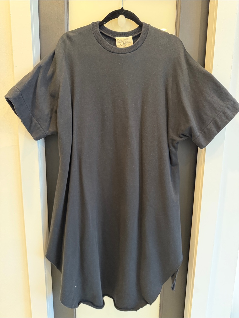 Women's Black Short-Sleeve Crewneck Oversized Sweatshirt or Dress with raw hem.
